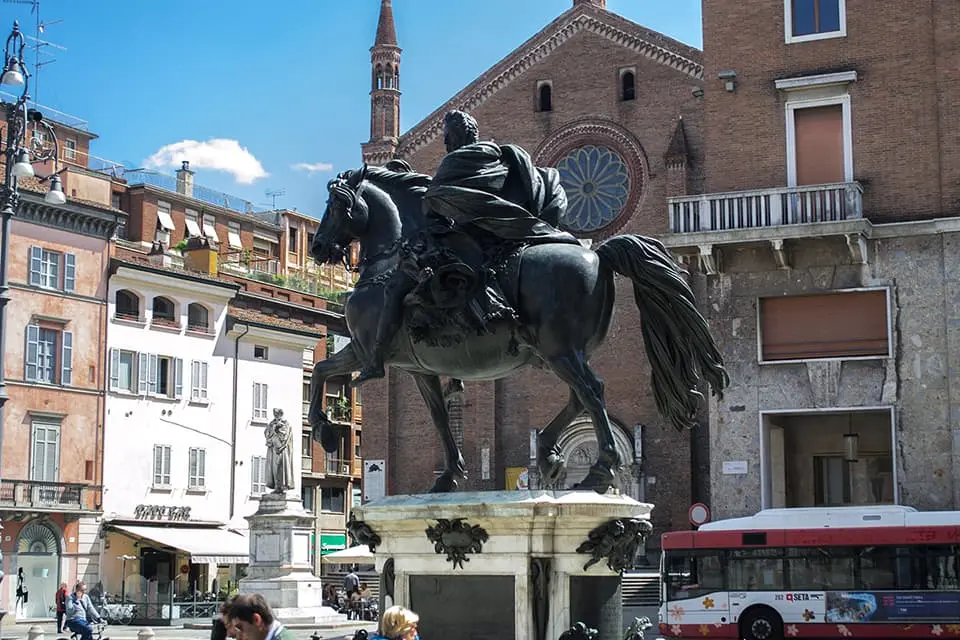 A statue of a man on a horse in the Italian city of Emilia-Romagna