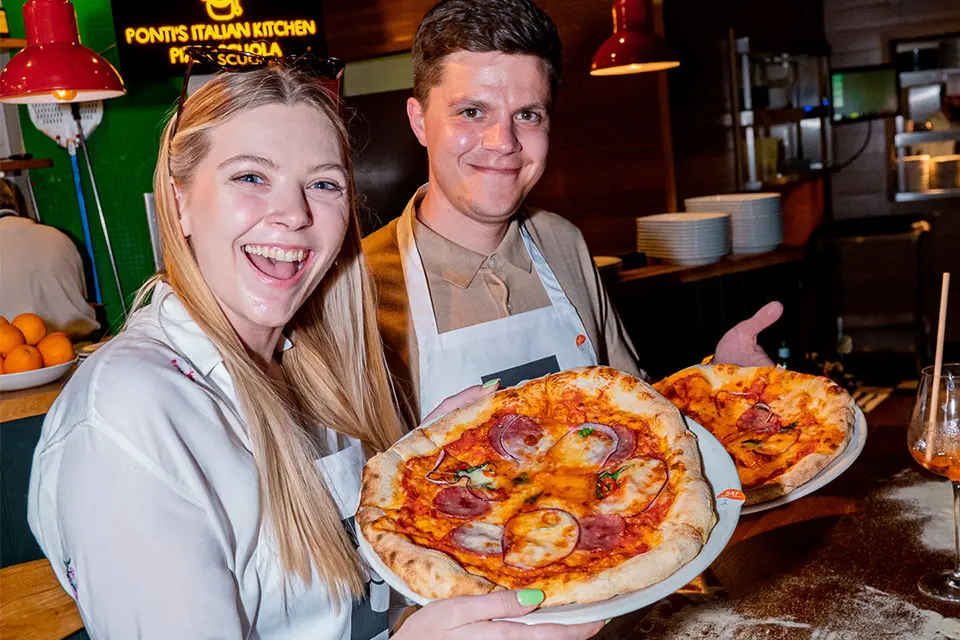 Students having fun creating homemade pizza's from Pizza Scuola, Ponti's Oxford Circus, London
