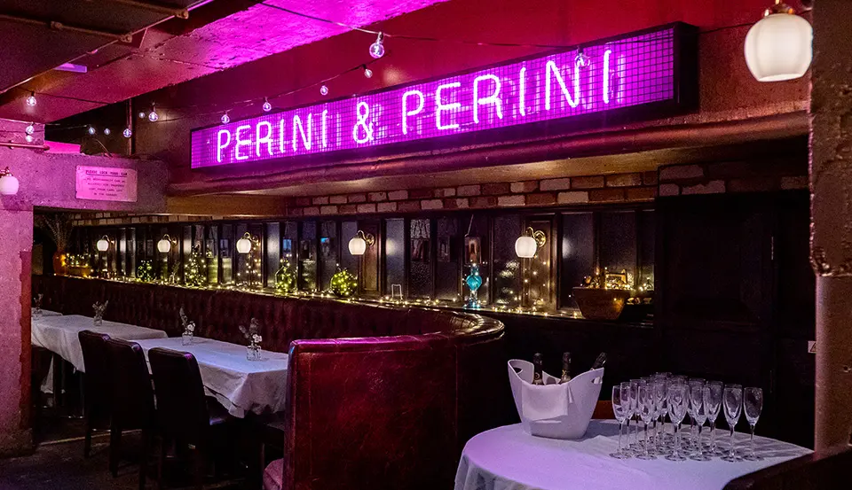Interior view of Perini & Perini bar and neon sign, Oxford Circus